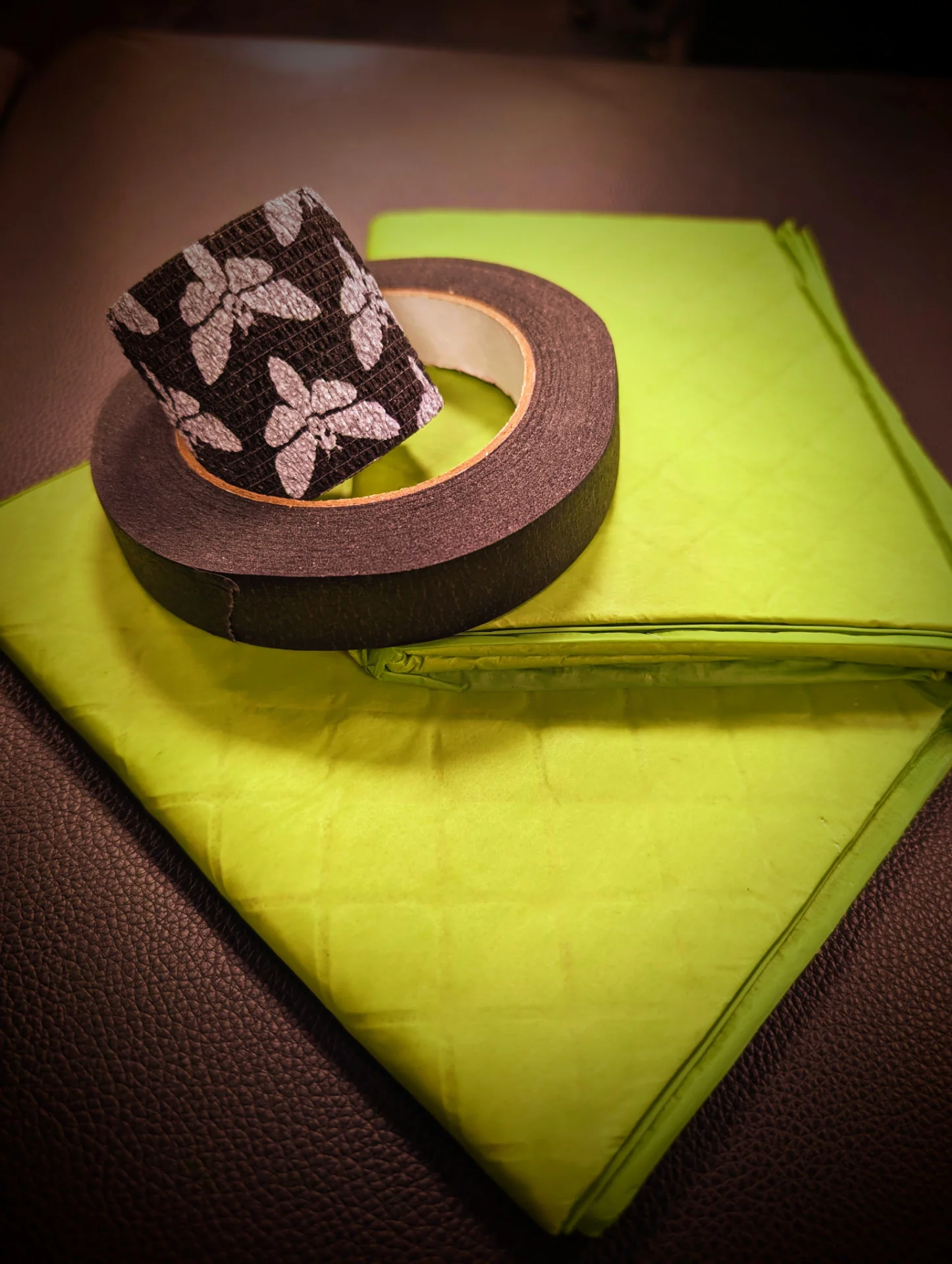 Absorbent pads and micropore tape used for Method B tattoo aftercare
