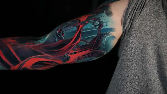 abstract biomechanical colour tattoo on full arm