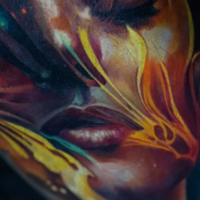 colour realism abstract melting face tattoo on chest