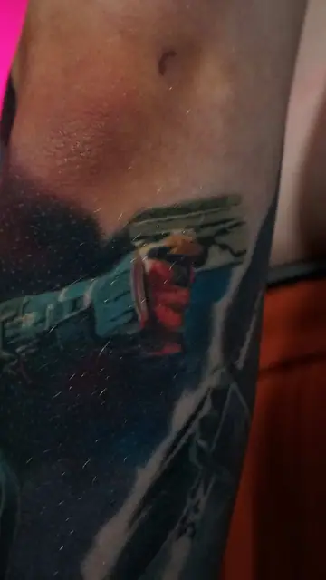colour realism astronaut hand/arm tattoo on arm