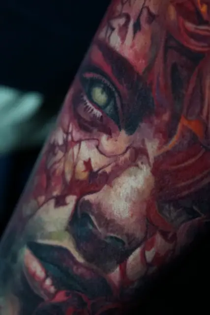colour realism demon female face tattoo on arm
