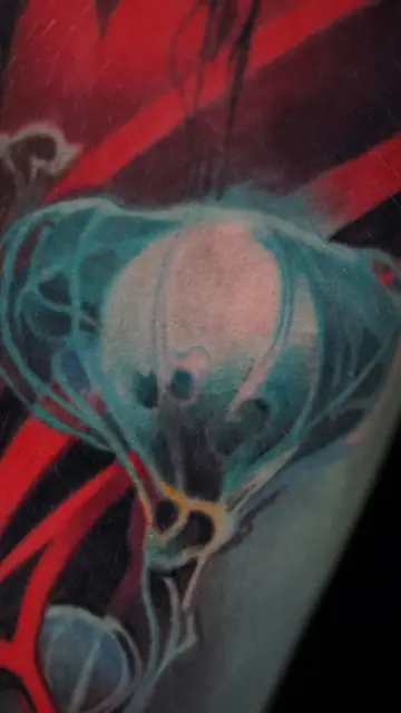 colour realism glowing jellyfish tattoo on arm