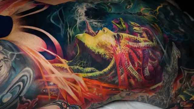 colour realism medusa octopus creature tattoo on side of body