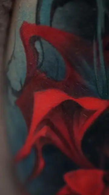 colour realism red fabric tattoo on arm