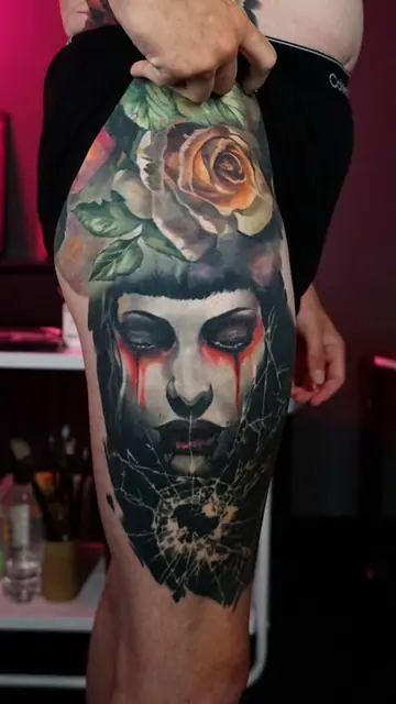 colour realism woman, rose, and broken glass tattoo on thigh