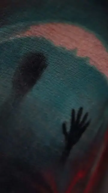 dark hand and silhouette colour tattoo on skin
