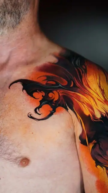 abstract fire colour realism tattoo on shoulder and arm