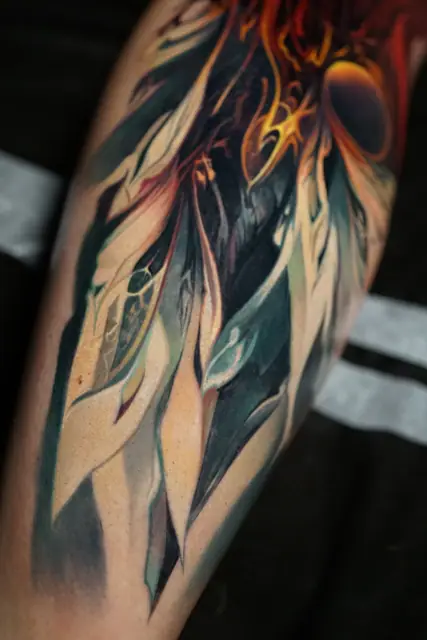 abstract organic colour realism tattoo on arm