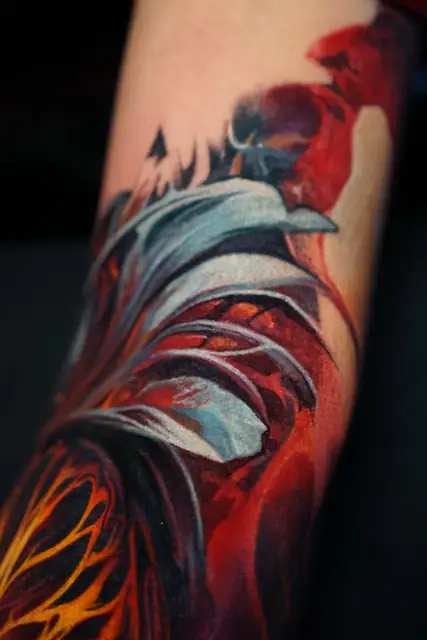 abstract organic colour realism tattoo on arm