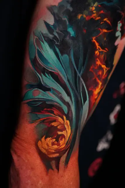 abstract plant and flame colour tattoo on arm