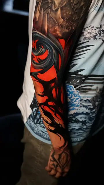 abstract red and black full sleeve tattoo