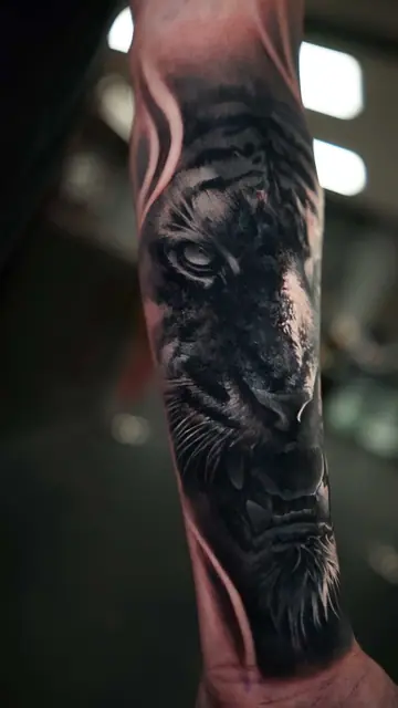 black and grey realism roaring tiger head tattoo on forearm