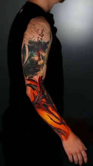 colour abstract skull and fire full sleeve tattoo