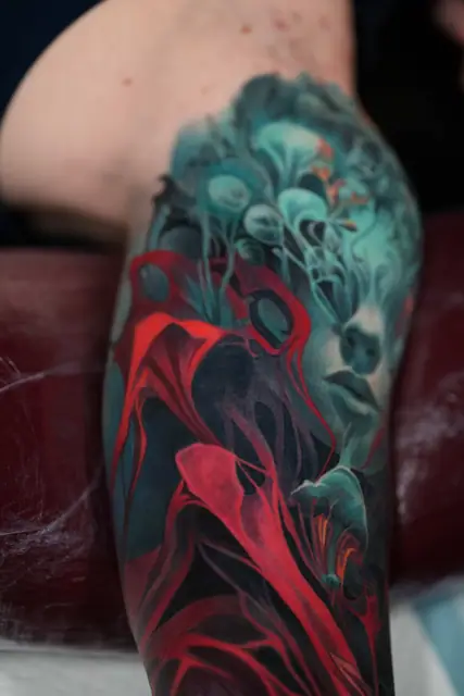 colour realism abstract face with red elements on upper arm