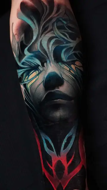 colour realism abstract face tattoo on forearm sleeve