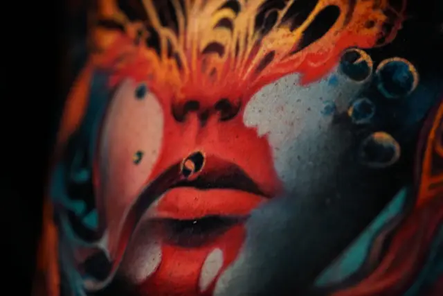colour realism abstract face tattoo with piercing