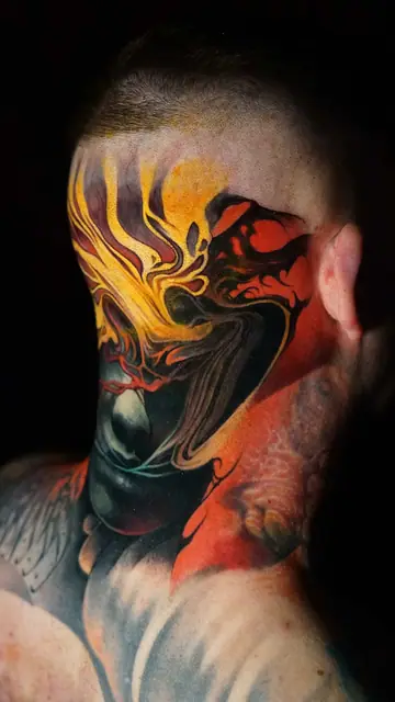 colour realism abstract face tattoo on side of head and neck