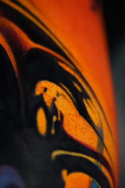 colour realism abstract fire tattoo on arm