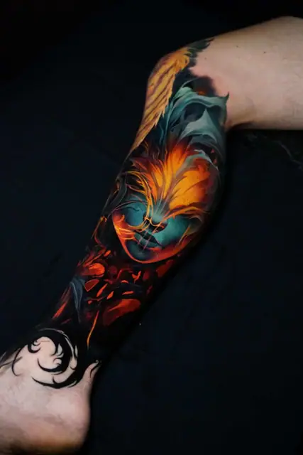 colour realism abstract fire tattoo on leg