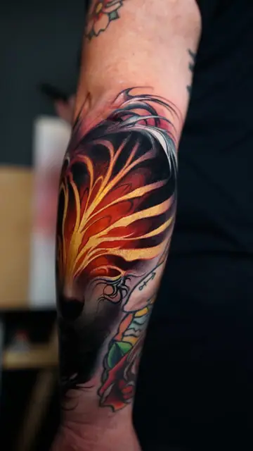 colour realism abstract flames tattoo on forearm