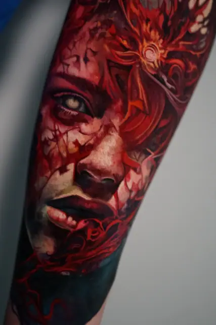 colour realism abstract woman's face tattoo on forearm