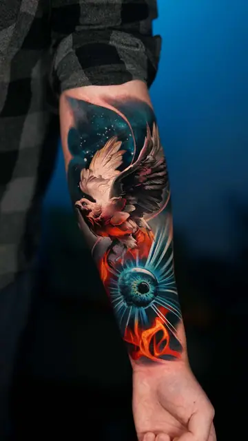 colour realism bird and eye with galaxy on forearm