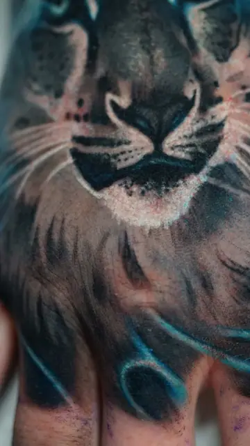 colour realism black panther tattoo on hand