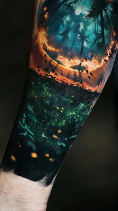 colour realism burning forest at night tattoo on forearm