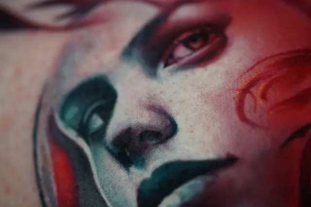 colour realism clown face tattoo on skin