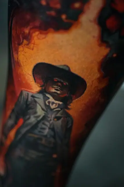 colour realism cowboy tattoo with red eyes on arm