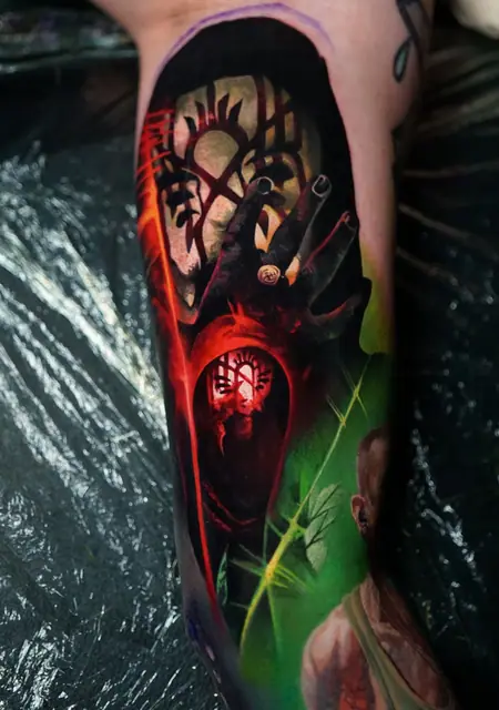 colour realism dark sorcerer hand tattoo on upper leg
