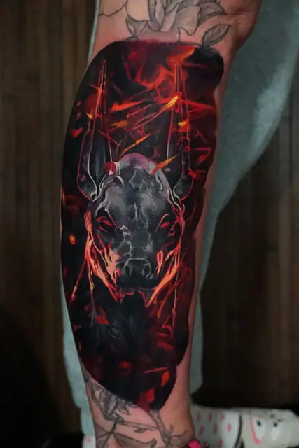 colour realism demon bull head tattoo on lower leg