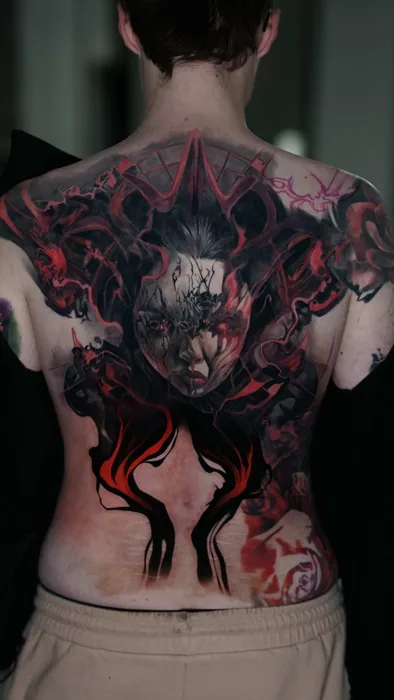 colour realism dark demon and woman's face full back tattoo