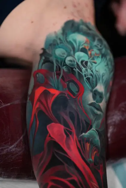 colour realism ethereal face with red abstract swirls on upper arm