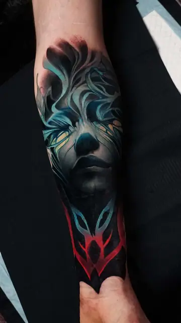 colour realism fantasy face and symbol tattoo on forearm
