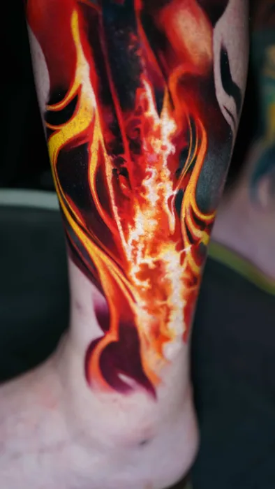close-up of fire and flame detail tattoo on ankle