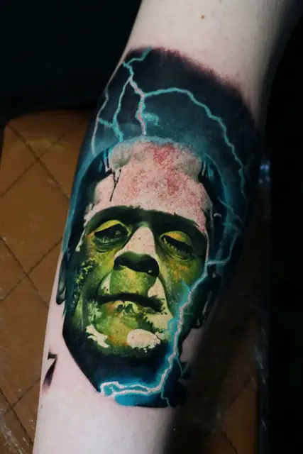 colour realism frankenstein monster tattoo on arm