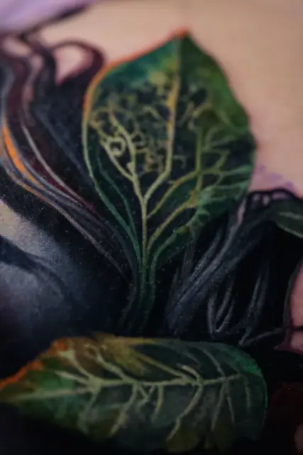 colour realism green leaves tattoo, unclear placement