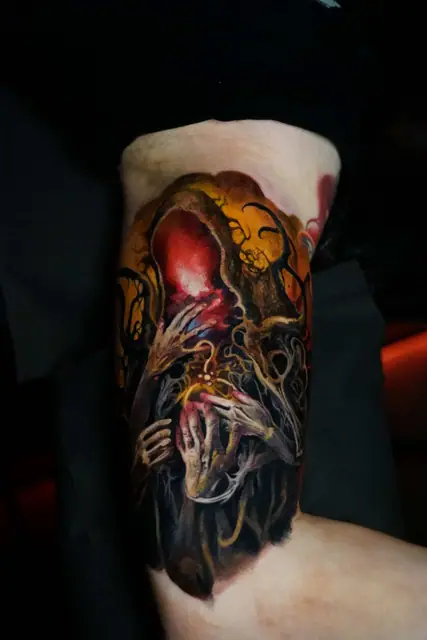 colour realism horror creature tattoo on upper thigh
