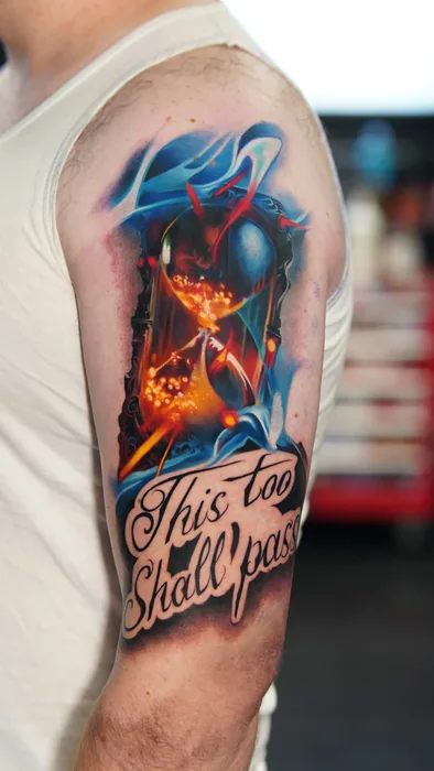 colour realism hourglass with fire and water tattoo on upper arm