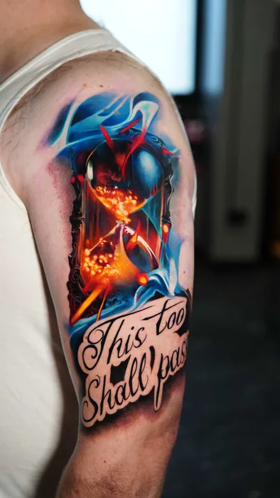 colour realism hourglass and lettering tattoo on shoulder