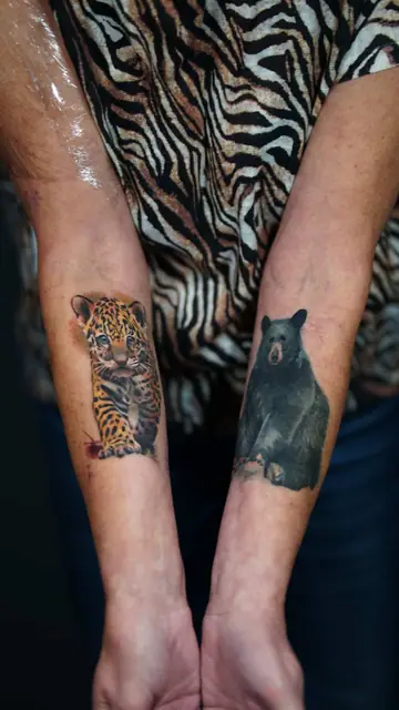 colour realism jaguar cub and black and grey bear tattoos on forearms