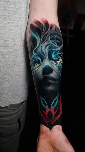 colour realism mystical face and abstract symbol on forearm