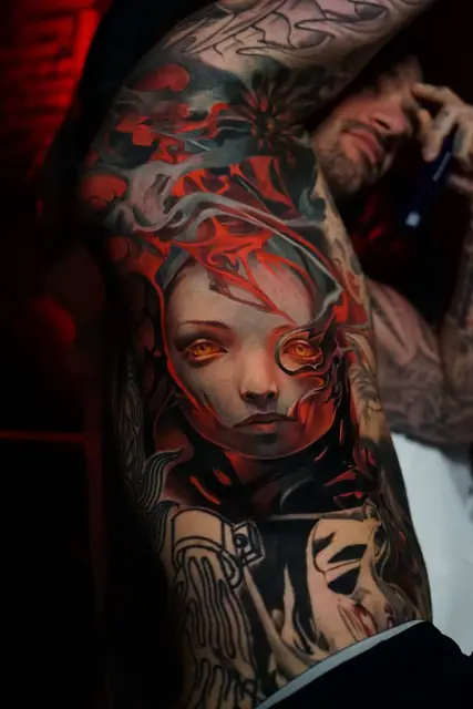 colour realism portrait with red flames tattoo on torso and arm