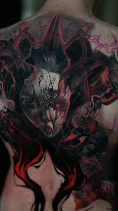 colour realism red and black demon back piece tattoo in progress