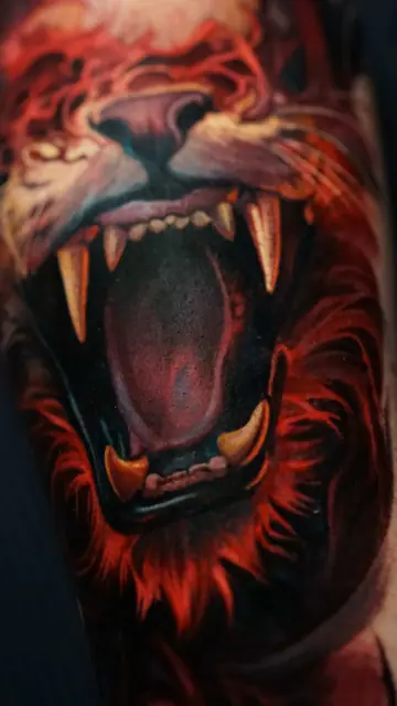 colour realism roaring lion tattoo on arm