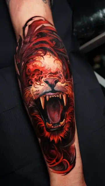 colour realism roaring lion tattoo on forearm