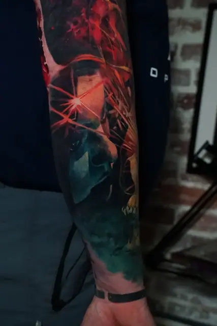colour realism sci-fi character with red beams full sleeve tattoo