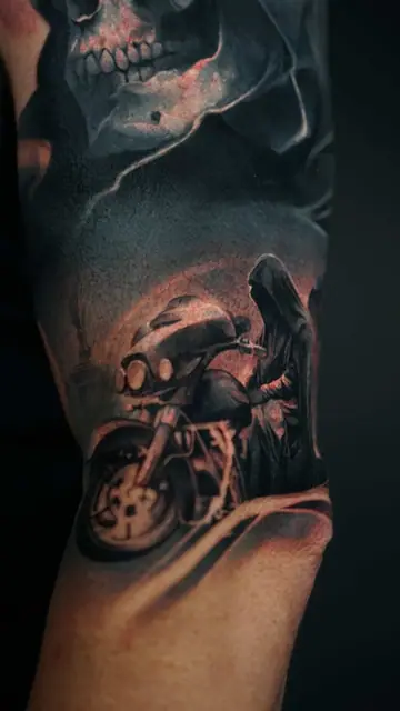colour realism skull and grim reaper with motorcycle tattoo on arm