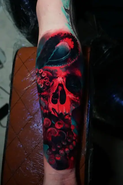 colour realism skull and octopus tattoo on forearm